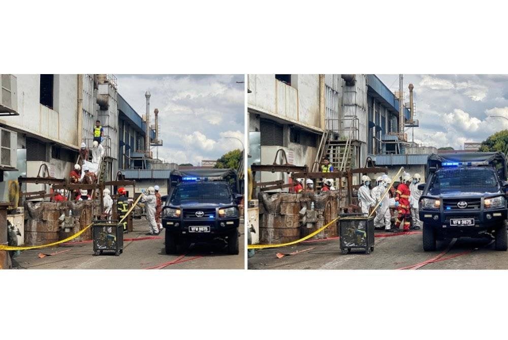 Mayat mangsa rentung ketika dibawa keluar dari bilik transformer sebuah kilang di Tangga Batu pada Isnin.