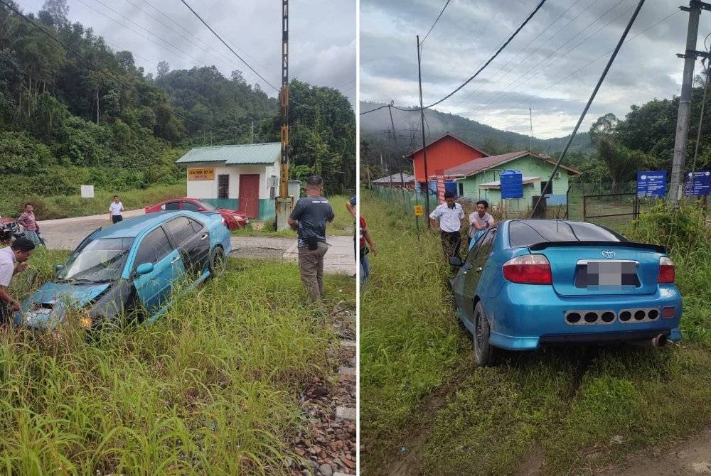 Kereta seorang guru rosak di bahagian hadapan selepas dirempuh kereta api di landasan di Kampung Halogilat, Beaufort.