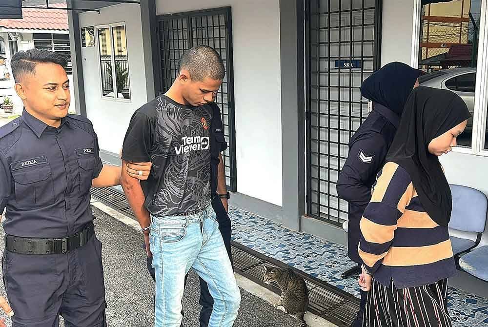 Nurul Ain dan Ermer Irfan diiring polis ketika hadir ke Mahkamah Majistret Port Dickson pada Khamis.