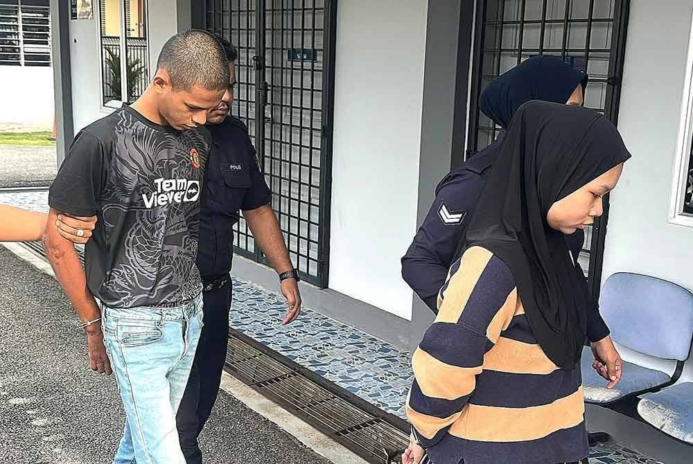 Nurul Ain dan Ermer Irfan diiring polis ketika hadir ke Mahkamah Majistret Port Dickson pada Khamis.
