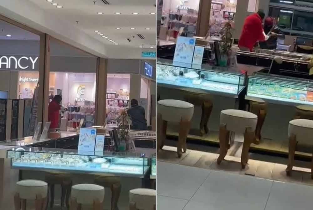 Tangkap layar daripada video tular mengenai kejadian rompakan di sebuah kedai emas dalam pasar raya dekat Bandar Baru Nilai.