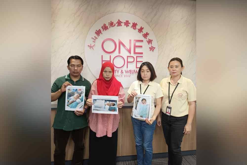 Mohd Waqiyuddin dan isteri menunjukkan keadaan anaknya ketika mendapatkan bantuan daripada One Hope Charity & Welfare bagi mengumpulkan dana untuk bayi mereka.