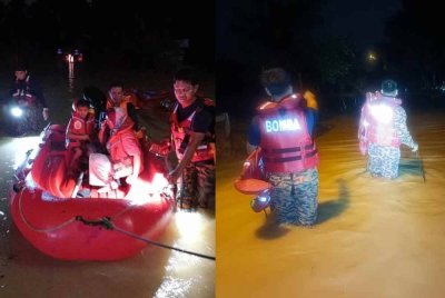Anggota bomba kita menjalankan operasi pemindahan mangsa banjir di Kampung Laut Skudai pada malam Rabu. Foto JBPM Johor