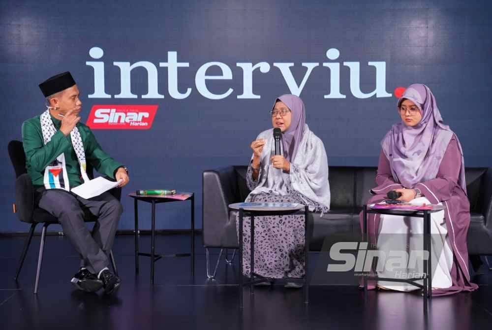 Marhaini (tengah) pada program Interviu bertajuk 10 Tahun World #QuranHour yang disiarkan secara langsung di semua platform digital Sinar Harian pada Khamis. Foto MOHD HALIM ABDUL WAHID-SINAR HARIAN