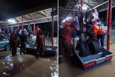 Guru yang terkandas di SK Tampoi Utama dipindahkan pasukan penyelamat pada awal pagi Jumaat. Foto JBPM Johor