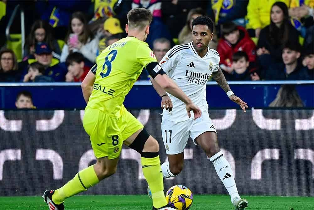 Rodrygo (kanan) menjadi buruan banyak kelab gergasi Eropah. FOTO: AFP