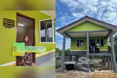 Halijah menunjukkan replika kunci yang diterima daripada MUIP sekaligus memberi kegembiraan bermakna buatnya.