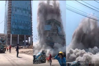 Video tular di media sosial menunjukkan bangunan bertingkat dengan kren di atasnya rebah ke tanah, diselubungi debu tebal, sementara orang ramai menjerit dan berlari menyelamatkan diri.