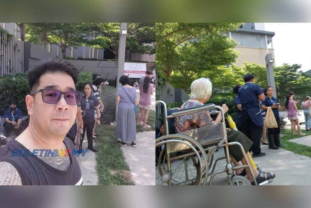 Khen Han Ming membantu wanita warga emas turun 40 tingkat bangunan kediaman di wilayah Nonthaburi, Thailand. Kredit foto: Buletin TV3