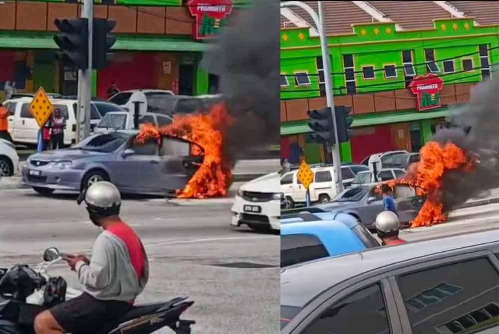 Tangkap layar video tular mengenai kebakaran sebuah kereta di persimpangan lampu isyarat Bukit Permata, Lumut pada Jumaat.
