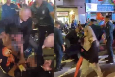 Tangkap layar video tular yang memaparkan kakitangan pihak berkuasa itu mengasari peniaga belon di Jalan Jalan Tuanku Abdul Rahman (TAR)