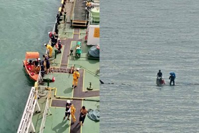 Dua nelayan warga Indonesia terselamat selepas bot mereka terbalik dipukul ombak kuat di perairan Pulau Tengah, Pelabuhan Klang, semalam. Foto Maritim Malaysia