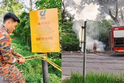 Bomba memadam api sampai berhampiran laluan paip gas di Taman Bukit Sendayan - Foto: JBPM