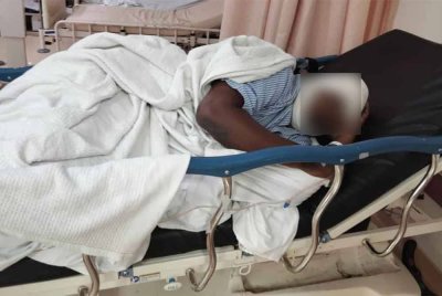 Pemandu lori yang diserang harimau kumbang di Jalan Bukit Tangga kini sedang menerima rawatan di Hospital Tuanku Jaafar. Foto ihsan Perhilitan