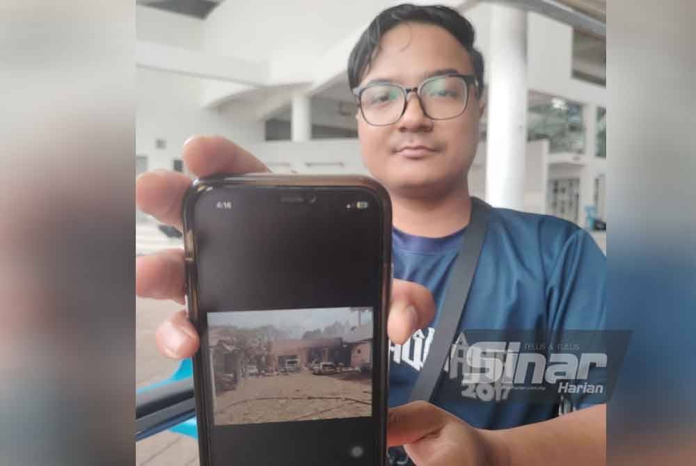 Muhammad Amirul menunjukkan kediaman ahli keluarganya yang musnah dalam insiden 1 April lalu.