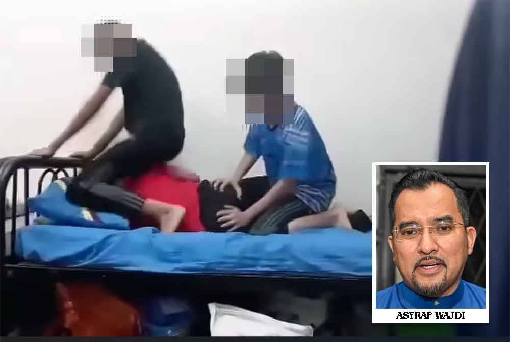 Tangkap layar daripada rakaman video yang tular memaparkan kejadian buli di sebuah MRSM.