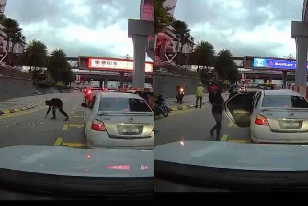 Pengguna jalan raya membantu mengutip duit milik seorang penghantar makanan yang dipercayai tercicir dompet ketika menunggang motosikal di Jalan Ibrahim Sultan berhampiran pusat beli-belah RMF Mall pada petang Rabu.