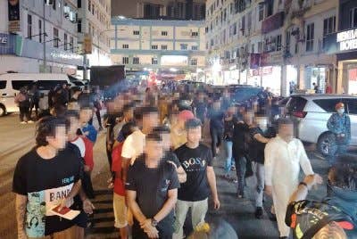 Antara warga asing yang ditahan dalam serbuan JIM di Hentian Kajang pada Khamis.