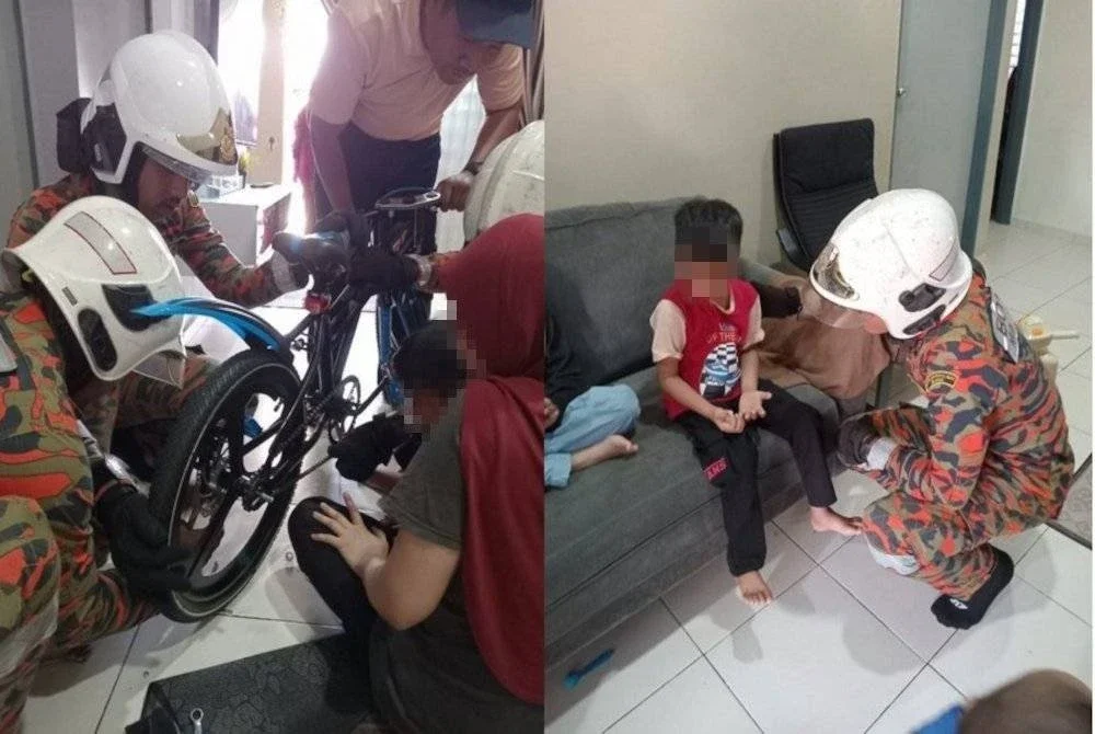 Pasukan bomba memberikan bantuan bagi melepaskan jari seorang wanita bersama anaknya yang berumur enam tahun, yang tersepit pada rantai basikal di Taman Merlimau Permai pada Sabtu. Foto bomba