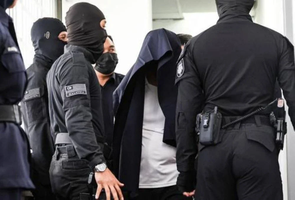 Pegawai kanan polis, DSP Mohd Nazri Abdul Razak (tengah) dituduh membunuh Muhammad Zaharif Affendi Muhd Zamrie, 17, dua tahun lepas. Gambar fail