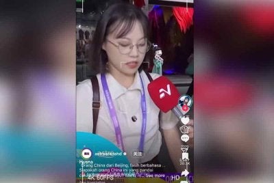 Husna ketika membuat liputan di liputan Sukan Asia 2023 di Hangzhou, China.