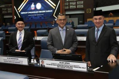 Nizam (tengah) ketika hadir pada sidang DUN Sabah pada Khamis. 