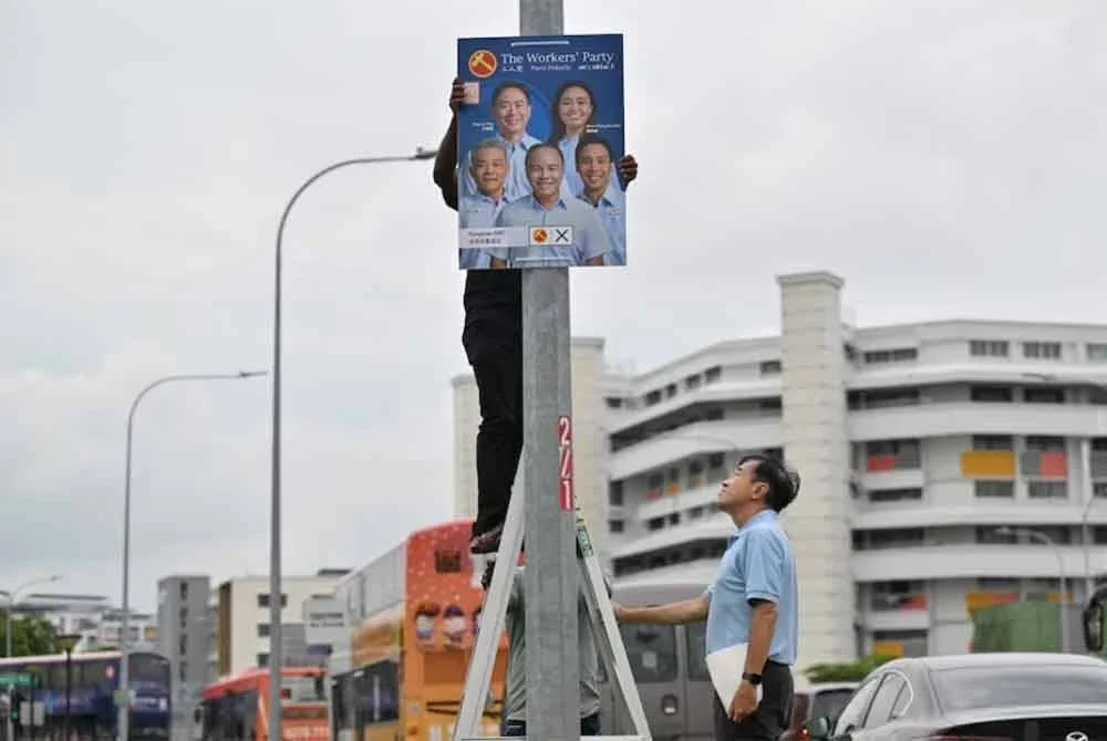 Wakil Parti Pekerja (WP) sudah mula menggantung poster calon mereka.