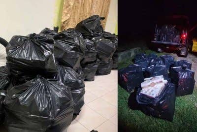 Timbunan plastik hitam yang mengandungi rokok seludup dirampas Pasukan Polis Marin Wilayah Tiga dalam satu serbuan di pesisir Sungai Mak Neralang, Kok Keli pada awal pagi Isnin.