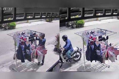 Tangkap layar video merakam tindakan suspek mencuri pakaian dalam yang dijemur mangsa di hadapan rumah di Menglembu pada Selasa. Foto ihsan pembaca