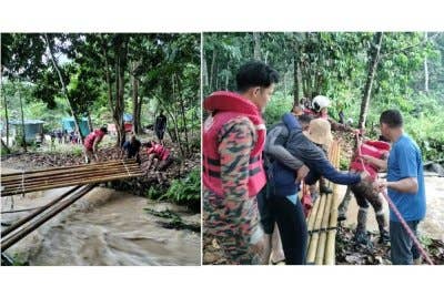 Anggota bomba menyelamatkan mangsa terperangkap insiden kepala air di Sungai Lepoh pada Ahad.