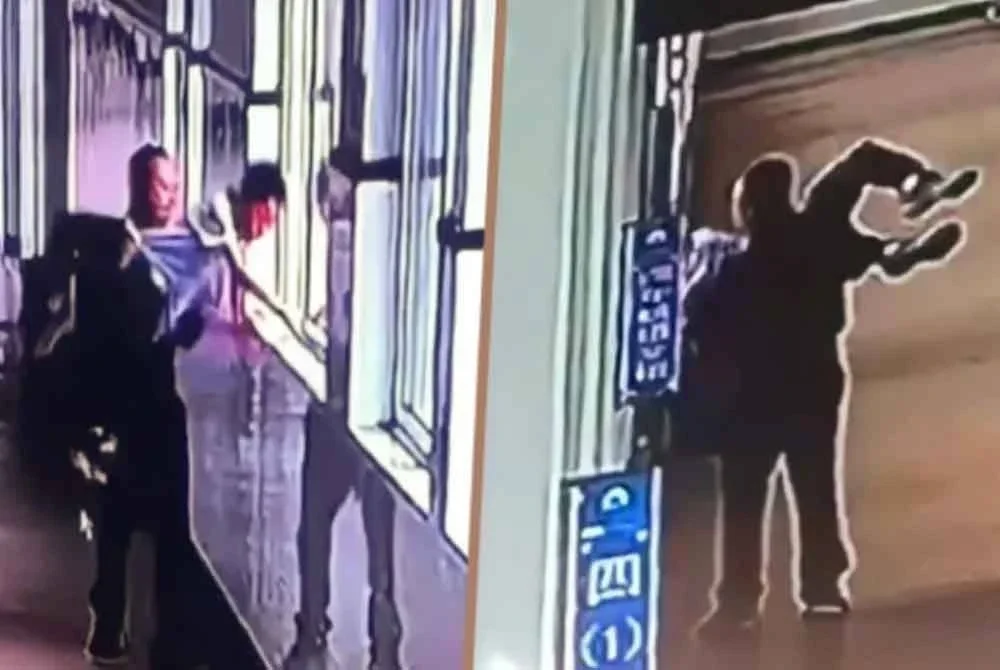 Rakaman CCTV menunjukkan guru mengancam untuk campak murid keluar bangunan sekolah selepas menyembur dengan pistol air. Foto Agensi