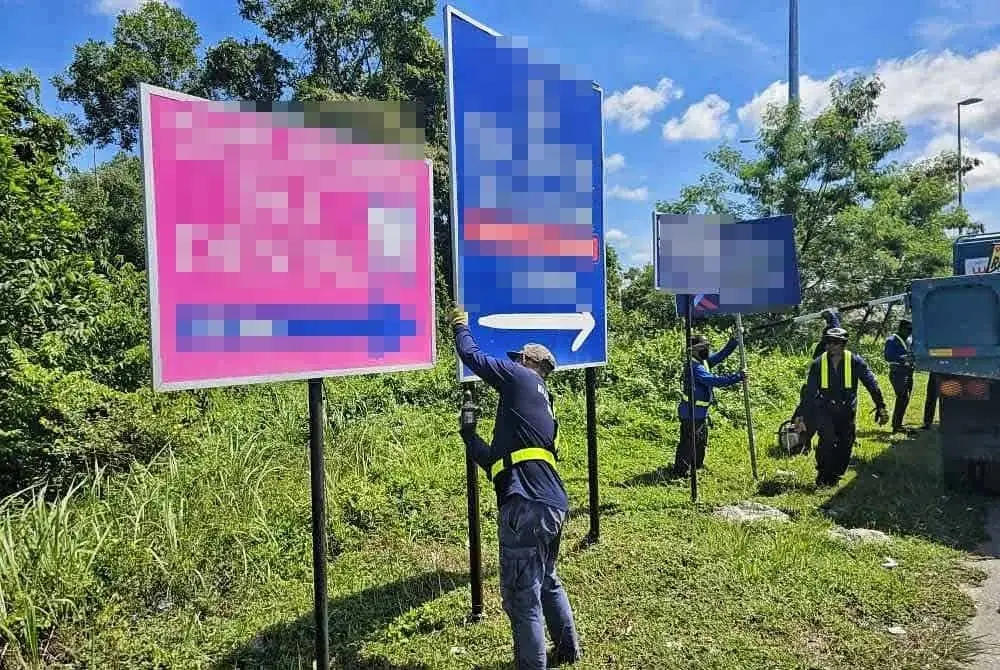 Pemasangan papan tanda tanpa kebenaran turut mencacatkan pemandangan bandar. Foto: Facebook MBK