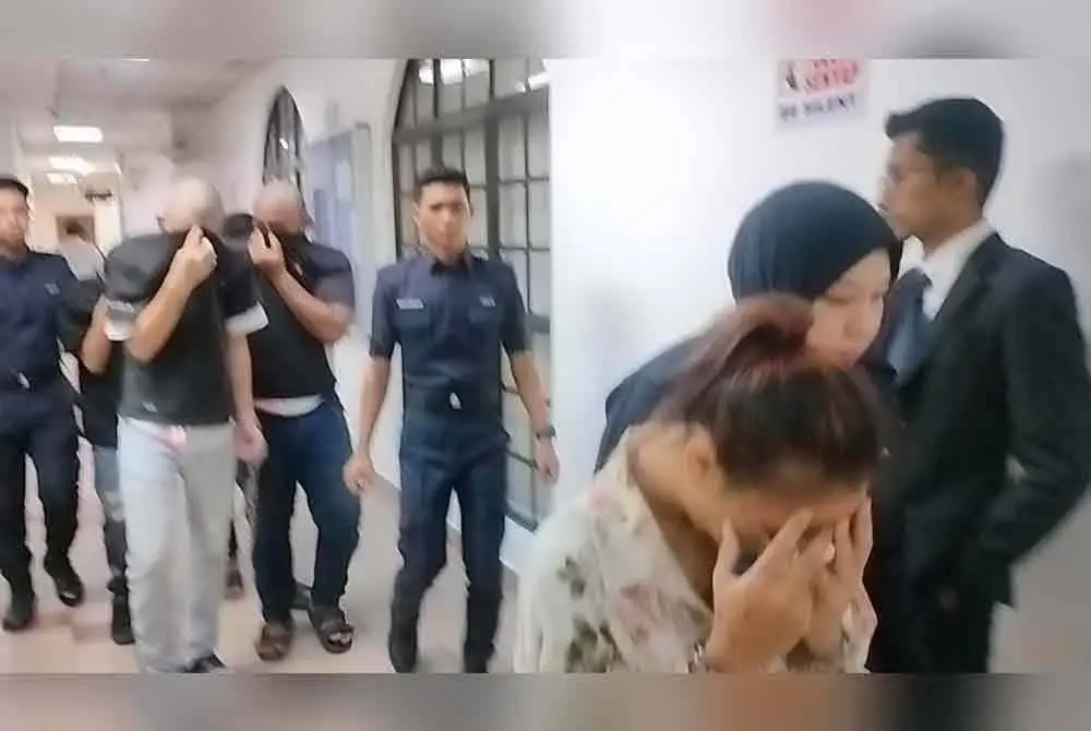 Bella dan tujuh tertuduh lelaki diiringi anggota polis hadir ke Mahkamah Majistret Johor Bahru pada Selasa.
