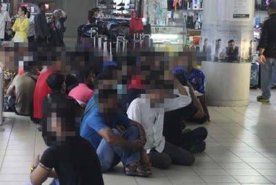Antara warga asing yang diperiksa JIM Pulau Pinang dalam Ops Kutip di sebuah pusat beli-belah di Butterworth pada Isnin.