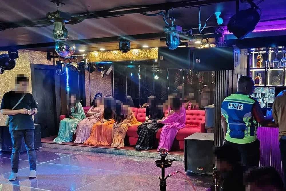 Antara wanita warga asing merupakan penari yang diperiksa semasa serbuan polis di ibu negara pada Ahad.