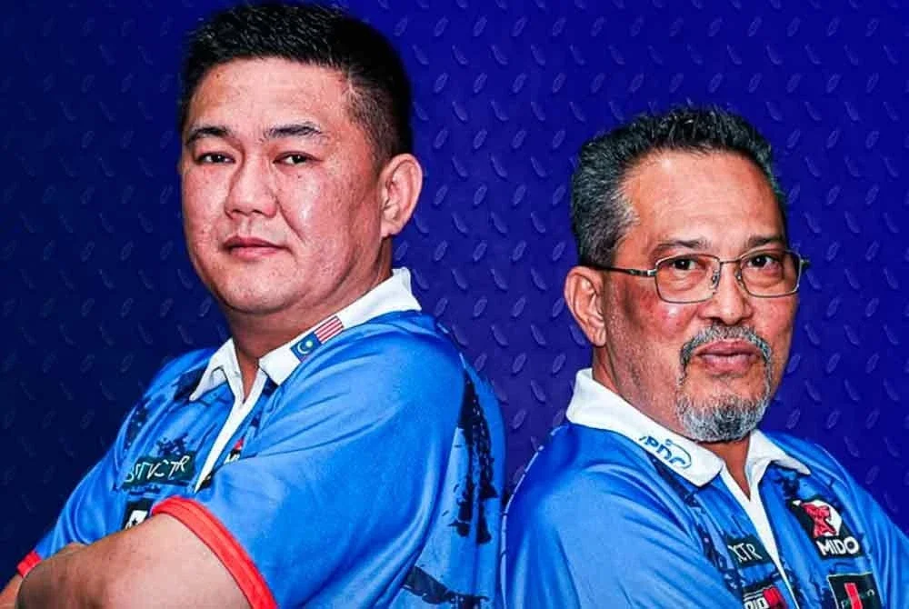 Perjalanan Tengku Shah (kanan) dan Jenn Ming dalam saingan Piala Dunia Dart di Jerman berakhir di peringkat kalah mati pada Sabtu.