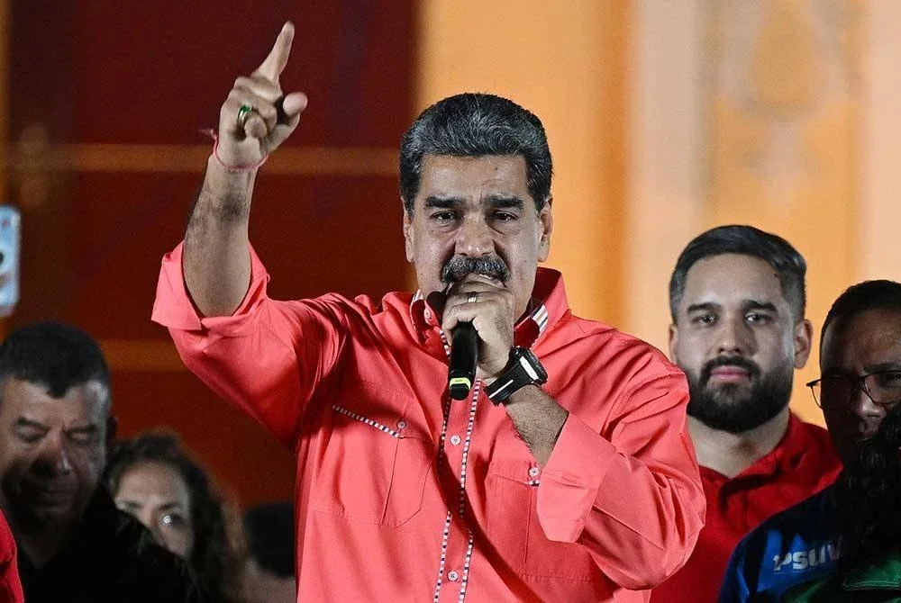 Nicolas Maduro ketika menyampaikan ucapannya.-AFP