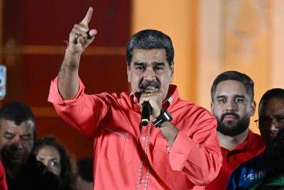 Nicolas Maduro ketika menyampaikan ucapannya.-AFP