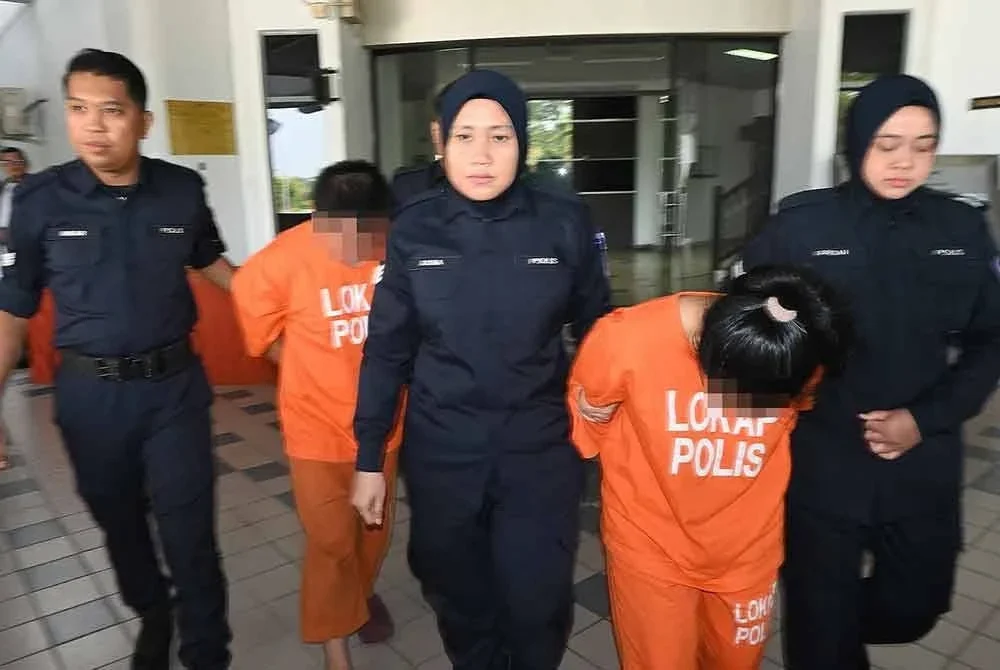 Wanita berusia 36 tahun dan lelaki berusia 38 tahun selepas dibawa keluar dari Mahkamah Majistret untuk permohonan reman.
