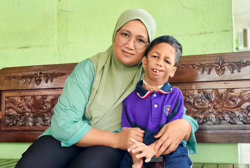 Noorbaizura perlukan RM14,950 lagi untuk kos pembedahan rahang Adib Rasul.