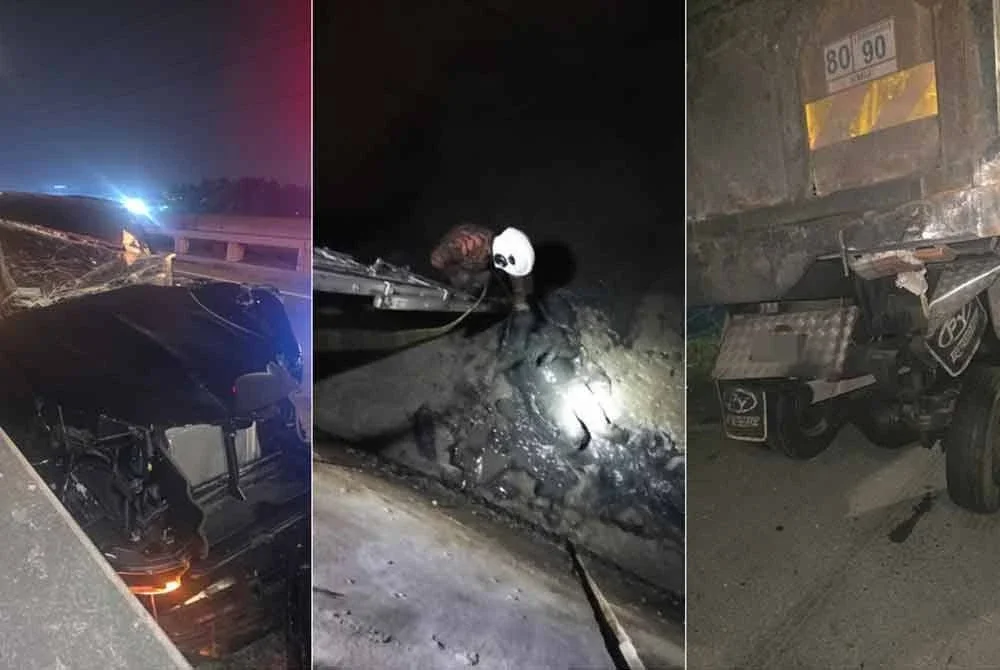Anggota bomba menyelamatkan pemandu yang tercampak ke dalam parit di kawasan paya bakau selepas melanggar sebuah lori dekat Jalan Pelabuhan Barat, Telok Gong, di Klang, Selangor, awal pagi Rabu. Foto Bomba