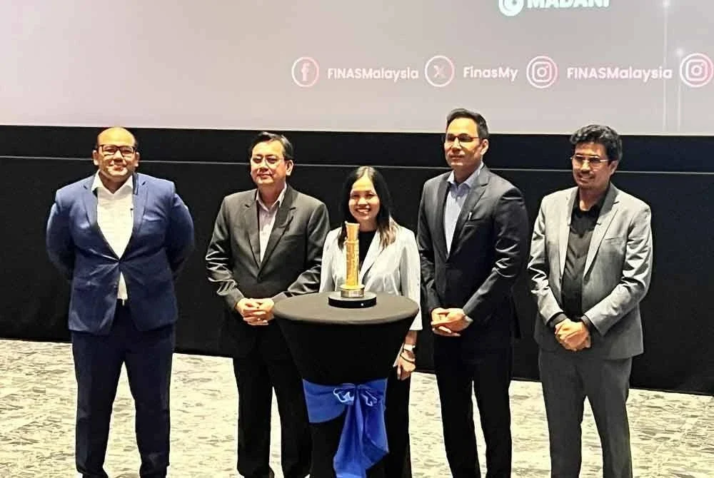 Nie Ching (tengah) pada majlis perasmian Festival Filem Malaysia ke-34 di Perbadanan Kemajuan Filem Nasional Malaysia di Hulu Kelang.