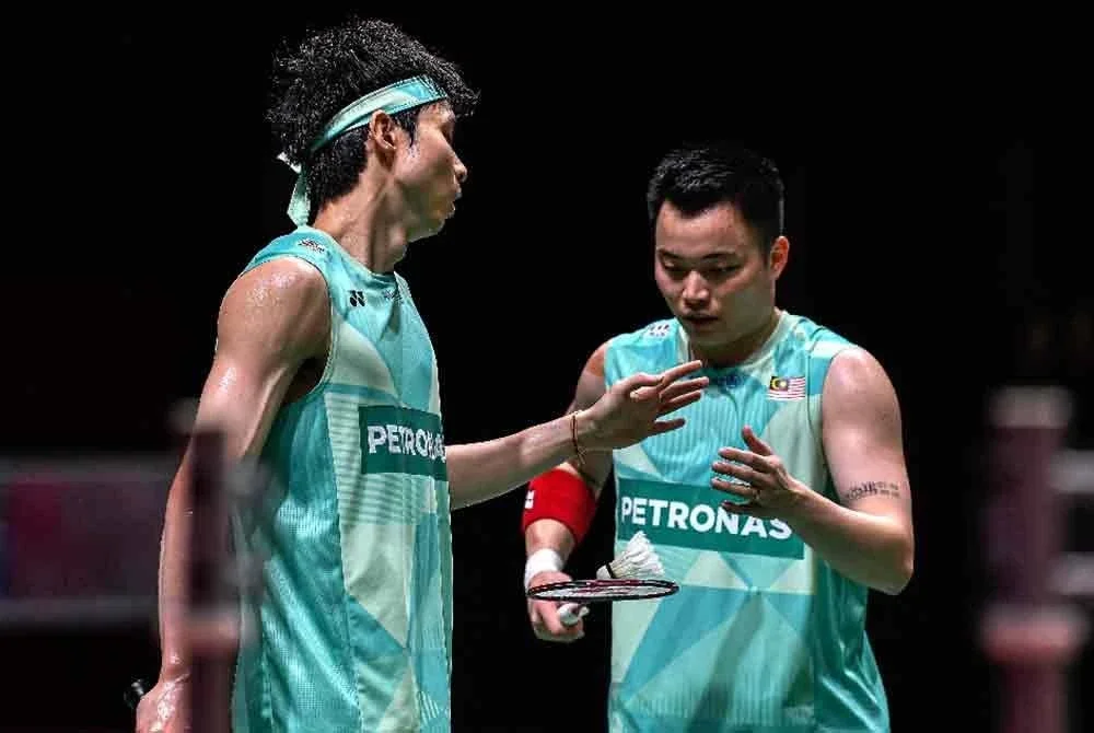 Aaron (kanan) dan Wooi Yik kembali memegang status beregu lelaki utama negara. Foto Agensi.