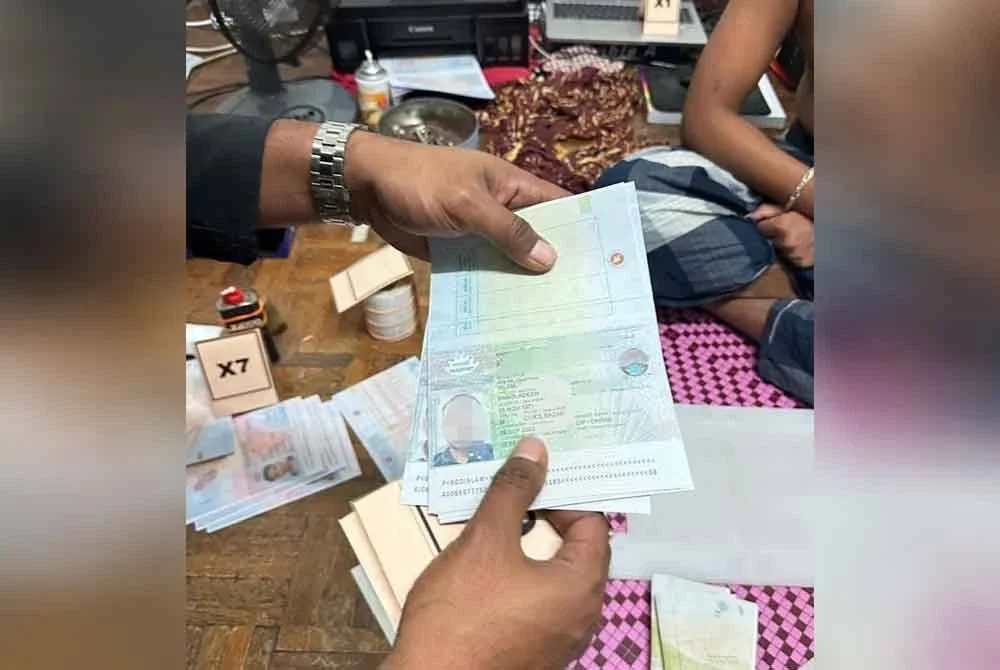 Antara naskhah pasport yang ditemui dalam serbuan di unit apartmen di Kepong pada Isnin.