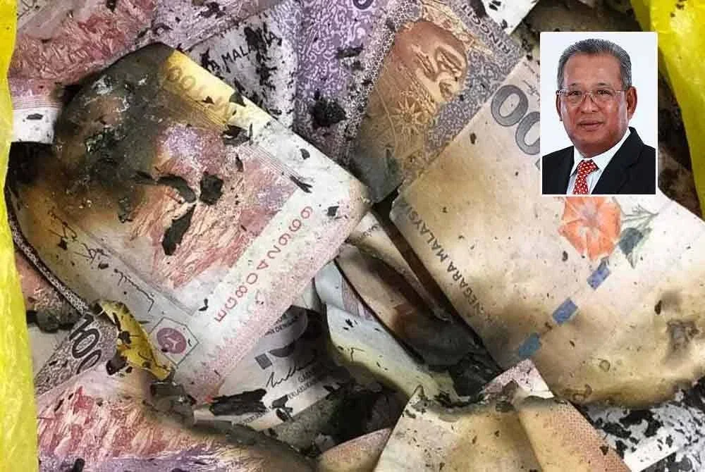 Wang tunai yang dibakar suspek semasa serbuan SPRM pada Khamis lalu. FOTO: SPRM
Gambar kecil: Zainul