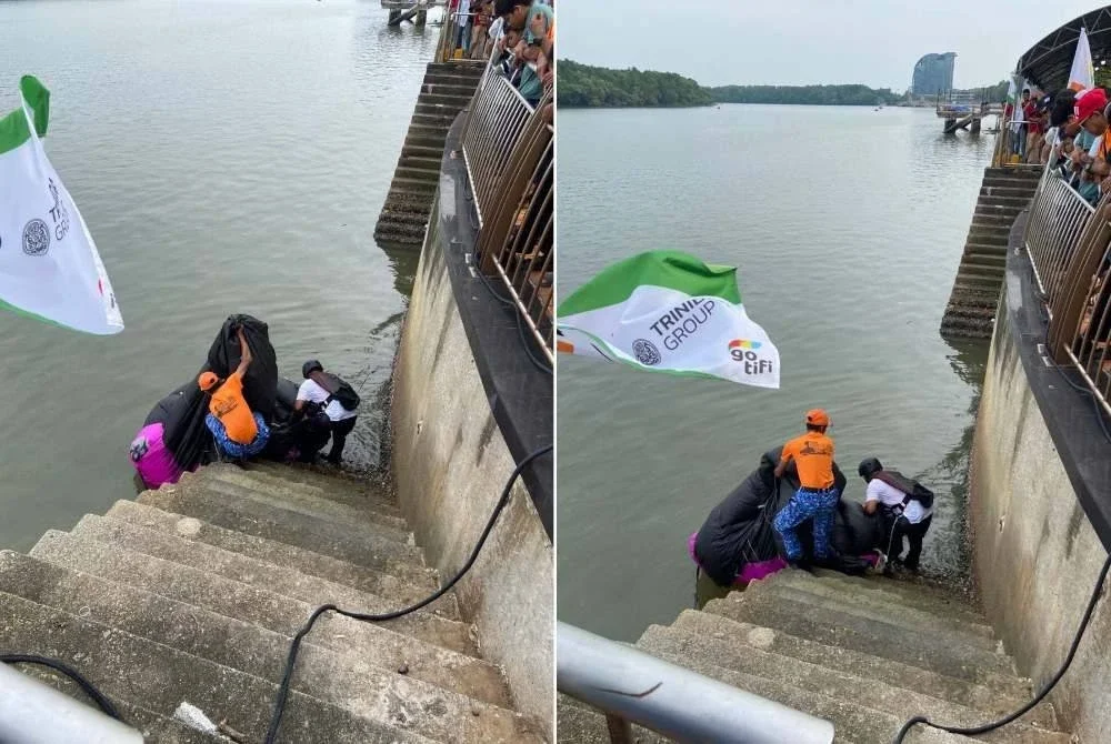 Petugas keselamatan mengambil tindakan pantas memberikan bantuan kepada peserta terjunan yang tersasar jatuh ke dalam sungai ketika melakukan pendaratan.
