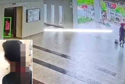 Tangkap layar video tular menunjukkan suspek berada di hadapan kawasan lif.