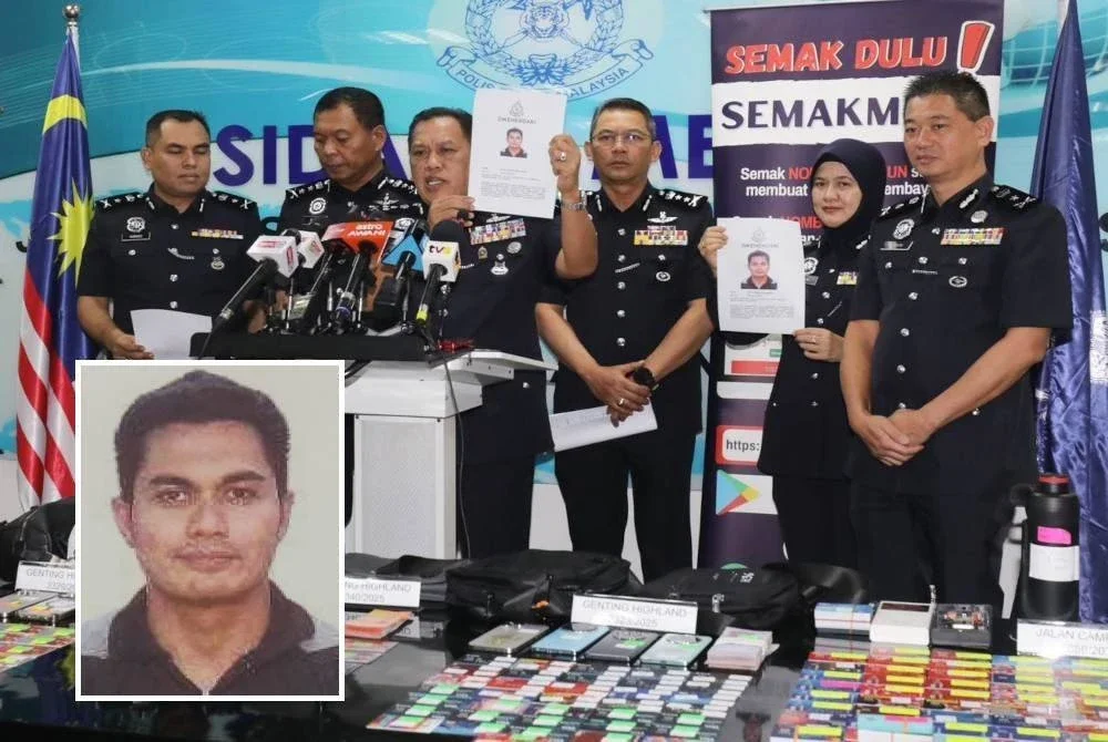 Rusdi menunjukkan gambar Mohd Ezman yang dikesan bagi membantu siasatan kes penipuan pelaburan.
