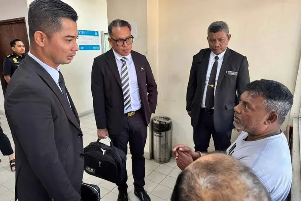 Tertuduh ketika dibawa ke Mahkamah Butterworth, pada Jumaat.