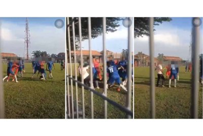 Tangkap layar video tular memaparkan pergaduhan melibatkan dua pasukan bola sepak yang berlaku di Padang Speedy, Teluk Intan pada Khamis. Foto ihsan pembaca